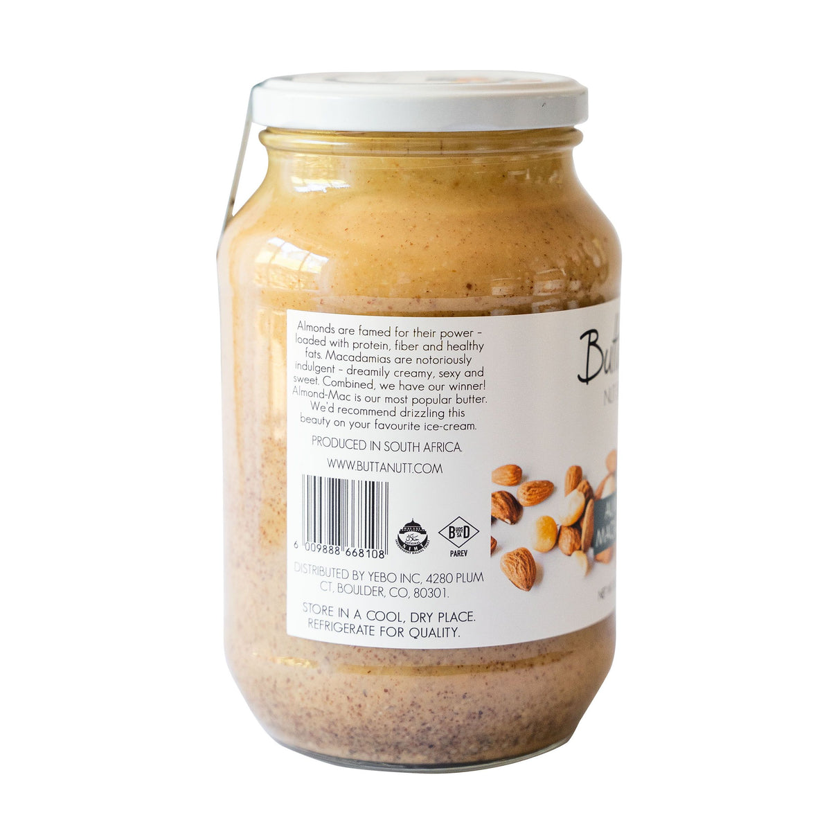 A jar of ButtaNutt Almond Macadamia Nut Butter showcasing product story on the label, against a white background